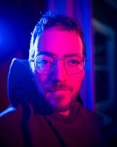 portrait of a man in glasses with monk robes